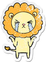 distressed sticker of a cartoon crying lion