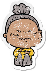 distressed sticker of a cartoon annoyed old lady