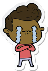 sticker of a cartoon man crying