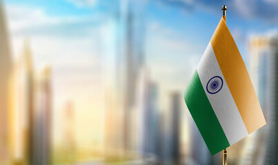 Small flags of the India on an abstract blurry background