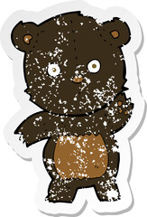 retro distressed sticker of a cute cartoon black bear