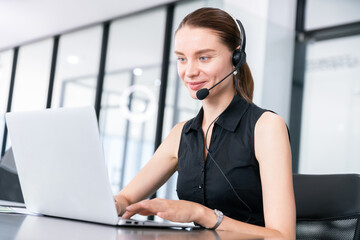 happy business assistant secretary work on business meeting with video conference onlin with computer and head set, or call center and hotline business service concept in modern office