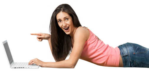 Young woman lying down in front of a laptop and pointing at the screen