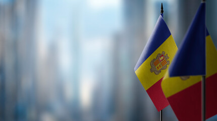 A small Andorra flag on an abstract blurry background - obrazy, fototapety, plakaty