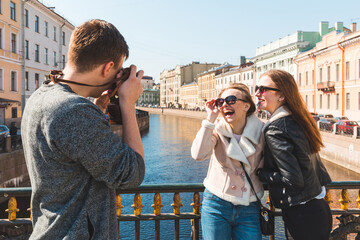 Group of friends enjoying day out in St Petersburg and taking photos
