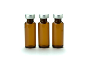 Medical bottle of brown color, for medicine and injection, with a lid, isolated on a white background. Close-up.
