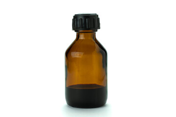 Brown glass medical bottle with liquid and black plastic cap, isolated on white.