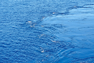 Pattern formed by swirling water in the sea from the propellers of a cruise ship. No people. Copy space. Backgrounds.