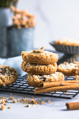 round festive pastry buiscuits cookies  with a raspberry jam on a light grey background.