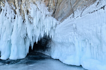 Rock Cliffs with Ice Grotto Near Olkhon Island on Lake Baikal During Winter