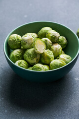 Raw Organic Brussel Sprouts in a Bowl, top view. Flat lay, overhead, from above. Copy space.