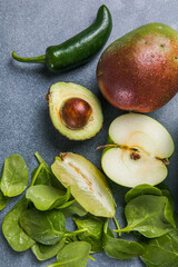 Healthy food clean food selection: fruits, vegetables, superfoods,  leaf vegetable on a gray concrete background
