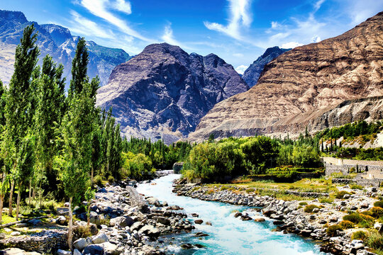 Gushing turquoise water of Gizer River, passing through a contrasting mountains in Gilgit-Baltistan, Pakistan  