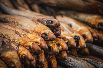Dried smoked Atlantic or Baltic herrings, Clupea harengus, a herring in the family Clupeidae in a...