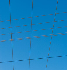 wires against blue sky