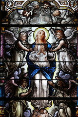 Fototapeta na wymiar Saint Augustin's church, Deauville, France. Stained glass. Mary's Assumption.