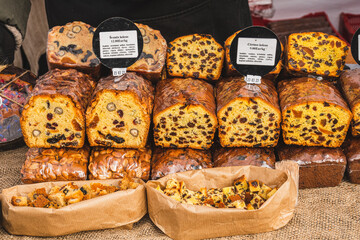 Assortment of different types of homemade rye cereals and sweet bread in a street food market