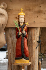 Beautiful wooden handmade statue of Saint Casimir's, in Kaziuko Muge, a spring annual folk arts and crafts fair in Vilnius, Lithuania, Europe, vertical