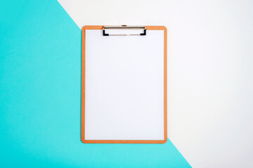 Clipboard with blank paper on blue and white background. Top view, flat lay, mockup