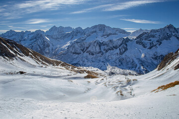 Fototapeta na wymiar A beautiful snowy scenery of the mountains in the italian Alps. Ponte di Legno, Italy.