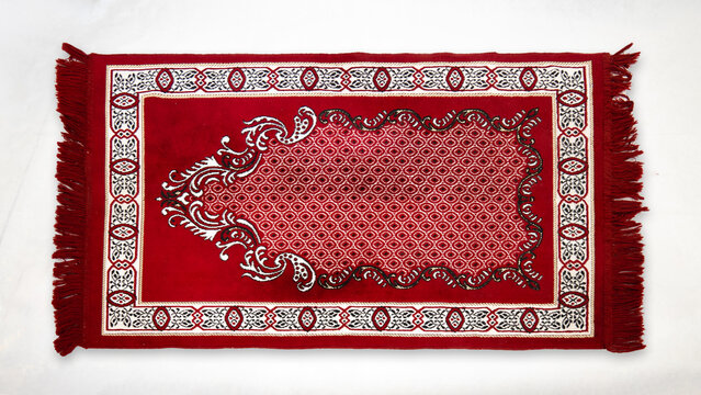 Decorative colorful prayer rug on white background