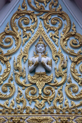 Fototapeta na wymiar Relief carvings in a Hua Hin temple. Thailand.