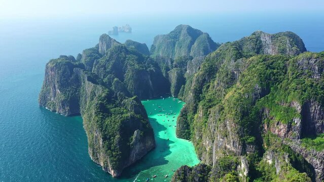 Aerial view of Koh Phi Phi   
island and the blue-green waters of Thailand with many tourist boats.