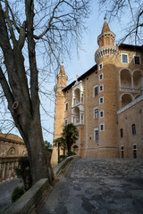 External view of the facade of the Ducal Palace of Urbino, Italy, ancient residence during renaissance of the dukes of Montefeltro - 580771387