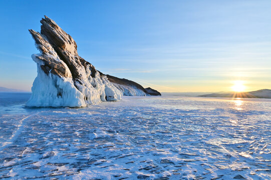Frozen Baikal Lake and Dragon Tail Rock on Ogoy Island in Siberia, Russia