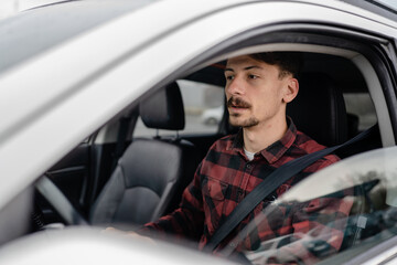 one man drive car adult male sitting on the driver's seat