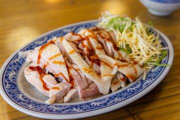 Cold steamed chicken dish in restaurant