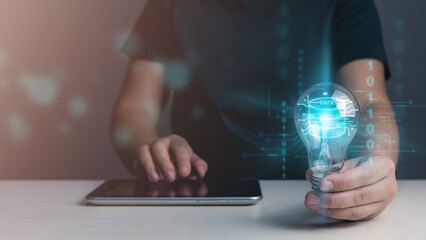 Businessman using tablet connecting to cloud computing technology concept, showing infographics global cloud network, cyber security, financial institution, database, internet of things, AI.