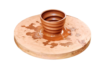 Lifestyle the process of creating pottery, isolated on a white background. Potter's wheel with the spinning a pot out of clay.