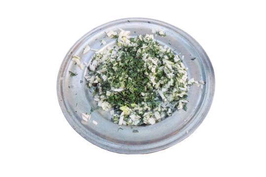 A metal plate with onions and dill, prepares food for the first American prospectors gold, isolated on a white background. Life of the first conquerors of the wild West.