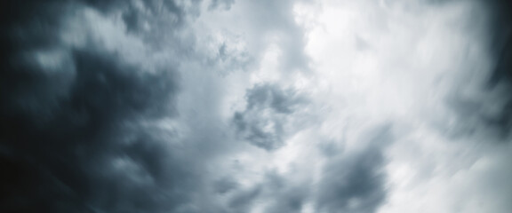 Dramatic cloudscape texture. Dark heavy thunderstorm clouds before rain. Overcast rainy bad weather. Storm warning. Natural gray background of cumulonimbus. Nature backdrop of stormy cloudy sky.