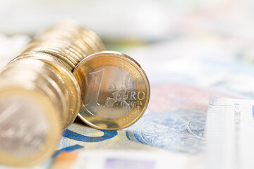 One Euro coin money saving pay paying finances with copyspace copy space