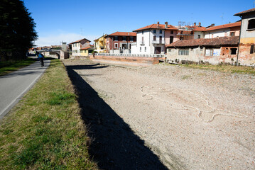 Fototapeta na wymiar Bernate Ticino MI, Italy - 03 11 2023 :Naviglio Grande dry due to the prolonged drought