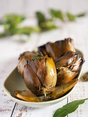 Grilled artichokes seasoned with olive oil