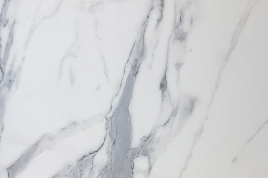 White marble texture with gray accents.