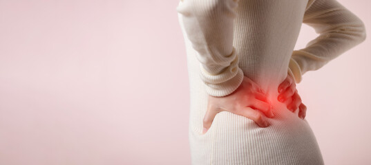 Young woman have waist pain, back ache, lumbar muscle injury problem. Office syndrome disease sick....