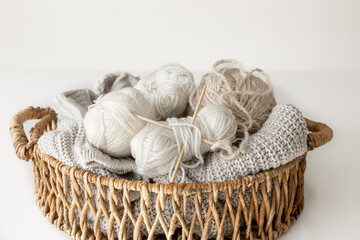 Basket with yarn close-up, threads for knitting.