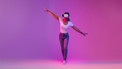 Black Woman In VR Headset Exploring Cyberspace Activities, Walking In Neon Light