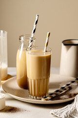Glass of protein chocolate drink, coffee refreshing drink, moody lifestyle photo