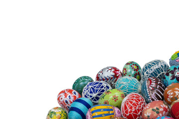 A collection of colorful Easter eggs arranged close together in the lower corner of the frame.