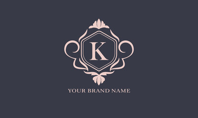 Exquisite baroque pattern. Floral ornament with initial letter K. Vintage frame, greeting card, wedding invitation. Vector logo template, label, business sign.