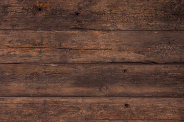 Obraz premium Background of old brown boards with visible grain and damage.