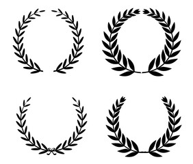 Set of black circular laurel wreaths. Round borders from branches. Decorative floral frames. Design elements for invitations and holiday cards. Vector illustration.