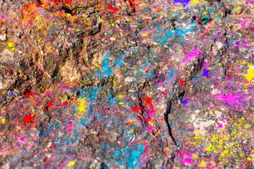 Multi-colored stone pavement after Holi festival in India. Dry paints in bright colors. High quality photo