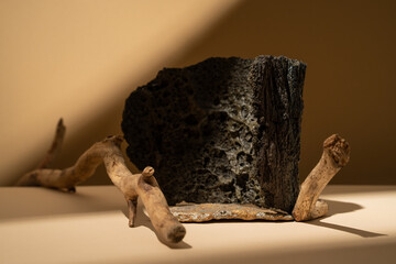 Empty stone podium with lava rock and branches. Mockup. Product display. Background.