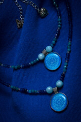 Fototapeta premium Choker made of natural stones and pendants and epoxy resin.